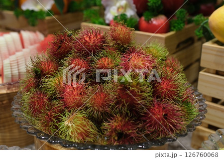 rambutan Fresh healthy red rambutan fruit pile on display at the local farmer's market. Freshly harvested rambutan fruit footage. rambutan Fresh healthy red rambutan fruit pile on display at the local farmer's market. Freshly harvested rambutan fruit footage. 126760068