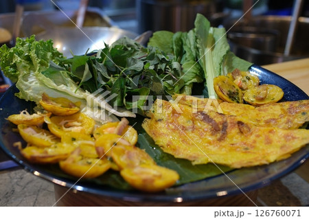 Vietnamese pancake banh xeo with fresh vegetable Vietnamese pancake banh xeo with fresh vegetable 126760071