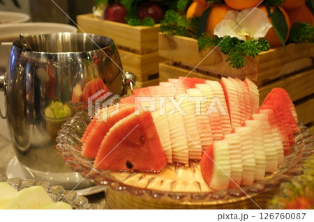 watermelon and watermelon slices on a half white background 126760087