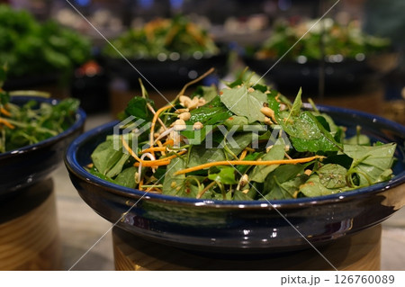 Mixing Green Salad , Millet,Crab Stick In glass bowl. Breakfast fresh salad and clean vegetable can eat raw. Nutritious and enzymes in Salad mix leaves green vegetable can detox.  126760089