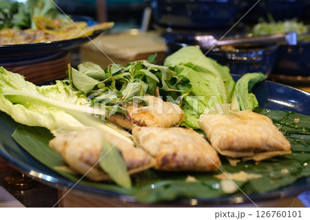 Fried wrapped Fried dumplings gyoza with soy sauce, and chopsticks, top view. 126760101