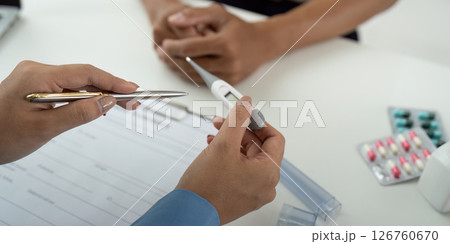 Health and Wellness: Nurse Discussing Medication with Patient 126760670