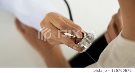 Health and Wellness. Doctor using stethoscope for patient examination. 126760676