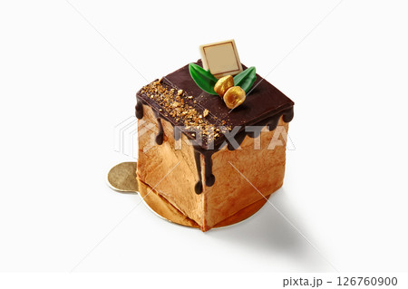 Delicious mini cake with chocolate icing and gold flakes on white background 126760900