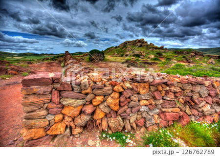 Masonry stonewall in spring with flowers, Menorca Balearic islands 126762789