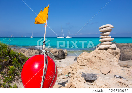 Stone figures on beach shore of Illetes beach in Formentera Stone figures on beach shore of Illetes beach in Formentera 126763072