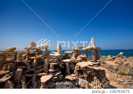 Stone figures on beach shore of Illetes beach in Formentera Stone figures on beach shore of Illetes beach in Formentera 126763075