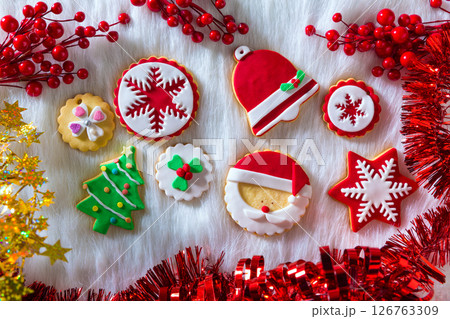 Christmas cookies Xmas tree Santa snowflake on white fur Christmas cookies Xmas tree Santa snowflake on white fur 126763309