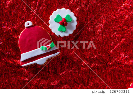 Christmas cookies Xmas bell on red background Christmas cookies Xmas bell on red background 126763311