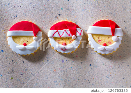 Christmas cookies with santa face on recycled paper Christmas cookies with santa face on recycled paper 126763386