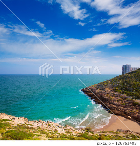 Cullera Cala beach near Faro in blue Mediterranean Cullera Cala beach near Faro in blue Mediterranean 126763405