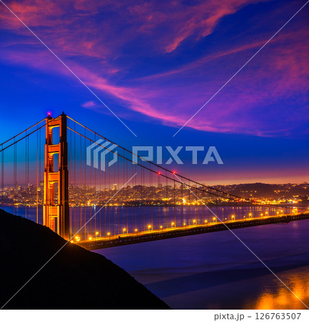 Golden Gate Bridge San Francisco sunset through cables 126763507