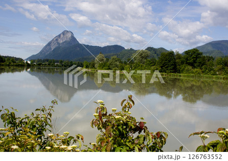 Reflections of the majestic mountain in the tranquil waters of Ebbs, Tyrol during a clear sunny day 126763552