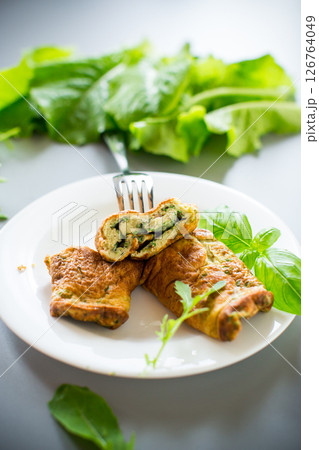 Protein omelette with greens on the table, top view Protein omelette with greens on the table, top view 126764049
