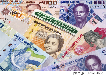 American Permanent Resident Card on a Sierra Leonean money 126764663