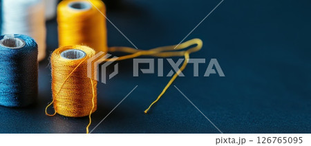 Colorful sewing threads create artistic patterns Colorful sewing threads create artistic patterns 126765095