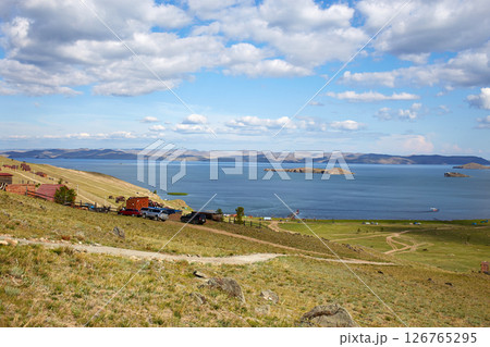 Baikal Lake. Beautiful view of the bays of the Small sea, the Kurkut Bay, on tourist camps and wooden hotel houses. 126765295