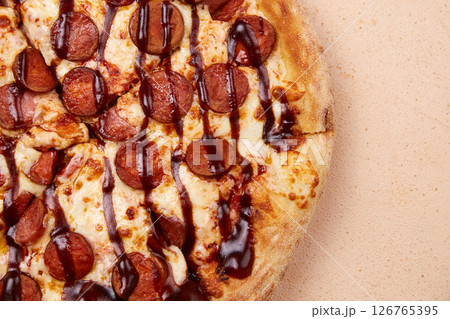 An appetizing sausage pizza, freshly made from the oven An appetizing sausage pizza, freshly made from the oven 126765395