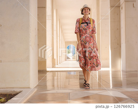 Young female tourist exploring iconic landmarks of the United Arab Emirates. 126766925