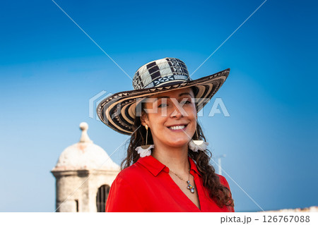 Beautiful young woman tourist wearing a sombrero vueltiao in Cartagena. Colombian people. Travel concept. 126767088