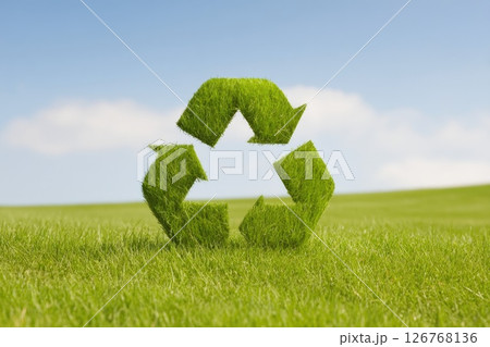 Grass Recycle Symbol on Green Field with Blue Sky 126768136
