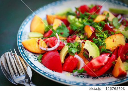 Fresh spring salad witn avocado, tomato, peach, red onion and herbs 126768708