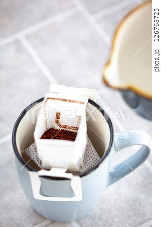 Hot black americano coffee and pouring milk Hot black americano coffee and pouring milk 126768723