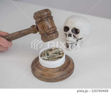 Judge Bangs Gavel. Chewing Tobacco Ban. Judge Bangs Gavel. Chewing Tobacco Ban. 126769409