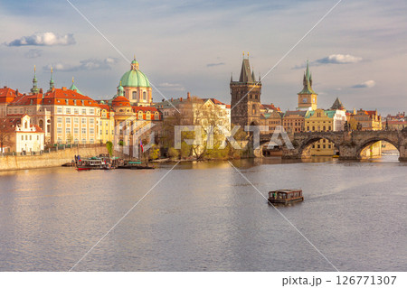 Charles Bridge and boat on Vltava River, Prague, Czech Republic 126771307