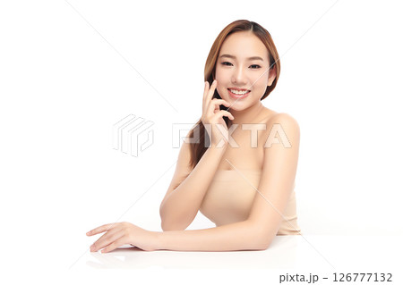A beautiful young Asian woman with clean, fresh skin against a white background. Skincare, facial treatment, cosmetology, beauty, and spa. An elegant portrait of an Asian woman. A beautiful young Asian woman with clean, fresh skin against a white background. Skincare, facial treatment, cosmetology, beauty, and spa. An elegant portrait of an Asian woman. 126777132