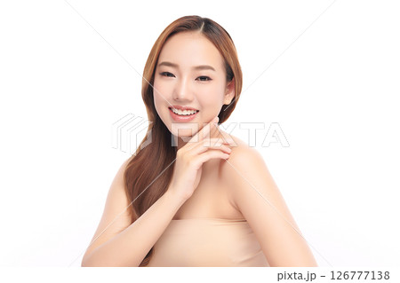 A beautiful young Asian woman with clean, fresh skin against a white background. Skincare, facial treatment, cosmetology, beauty, and spa. An elegant portrait of an Asian woman. 126777138