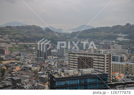 March 27 2025 Aerial View of Urban Landscape with Background Green Hills March 27 2025 Aerial View of Urban Landscape with Background Green Hills 126777878