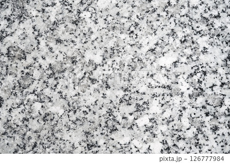background with granite texture on white ceramic tiles. Decorative surface with artificial pattern 126777984