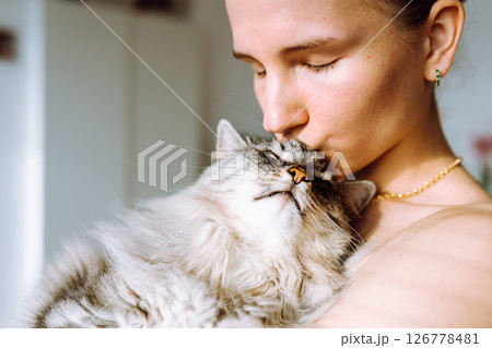 Portrait young woman with pet cat Portrait young woman with pet cat 126778481