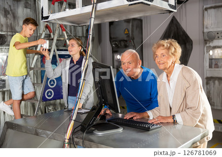 Grandparents and teenagers trying to get out of an escape room stylized under laboratory 126781069