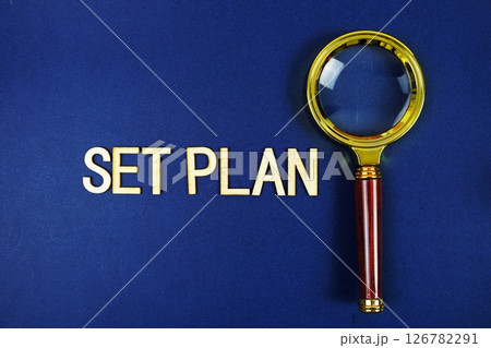 Set Plan alphabet letters with magnifying glass on navy blue background 126782291