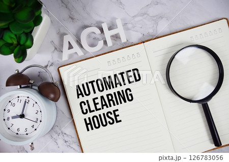 ACH - Automated Clearing House acronym on notepad, Business and Financial concept background 126783056