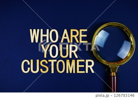 Who Are Your Customer? alphabet letters with magnifying glass on navy blue background 126783146