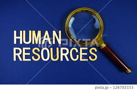 Human Resources alphabet letters with magnifying glass on navy blue background Human Resources alphabet letters with magnifying glass on navy blue background 126783153