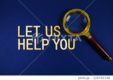Let Us Help You alphabet letters with magnifying glass on navy blue background Let Us Help You alphabet letters with magnifying glass on navy blue background 126783186