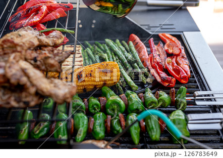 Grilled corn cobs, paprika, asparagus with temperature control. Grilled corn cobs, paprika, asparagus with temperature control. 126783649