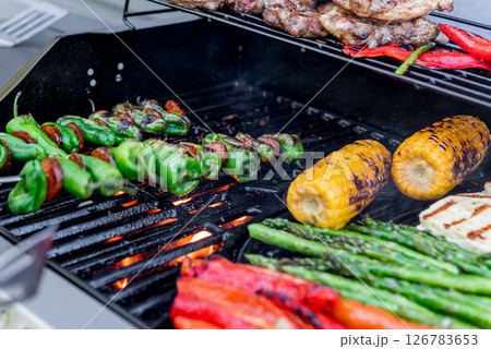 Grilling chicken, corn cobs, paprika, padron, asparagus. 126783653