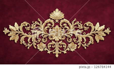 Gold rococo style stucco ornament with floral details on maroon background 126784144