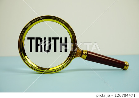 Truth text with magnifying on blue background 126784471
