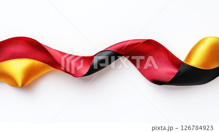 red, yellow and black ribbon or banner. The ribbon is made of a shiny, satin-like material and has a smooth texture.	 126784923