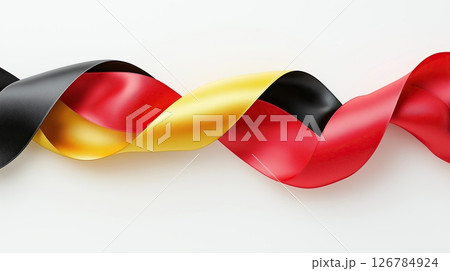 red, yellow and black ribbon or banner. The ribbon is made of a shiny, satin-like material and has a smooth texture.	 126784924