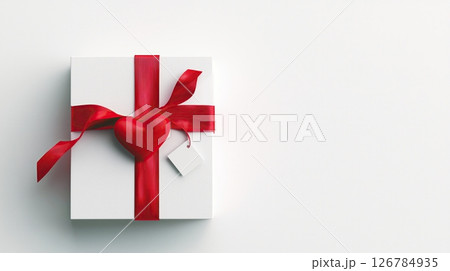 3D rendering a white gift box with a red ribbon tied in a bow on top. The ribbon is tied in the shape of a heart and is tied with a thin red ribbon	 3D rendering a white gift box with a red ribbon tied in a bow on top. The ribbon is tied in the shape of a heart and is tied with a thin red ribbon	 126784935