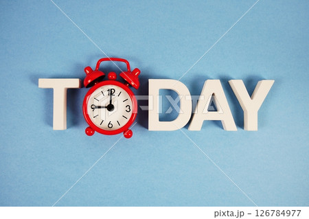 Today alphabet letters with alarm clock on blue background 126784977