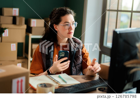 Woman working in a warehouse 126785798