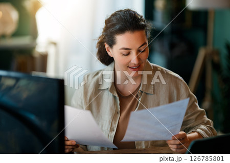woman working on laptop woman working on laptop 126785801